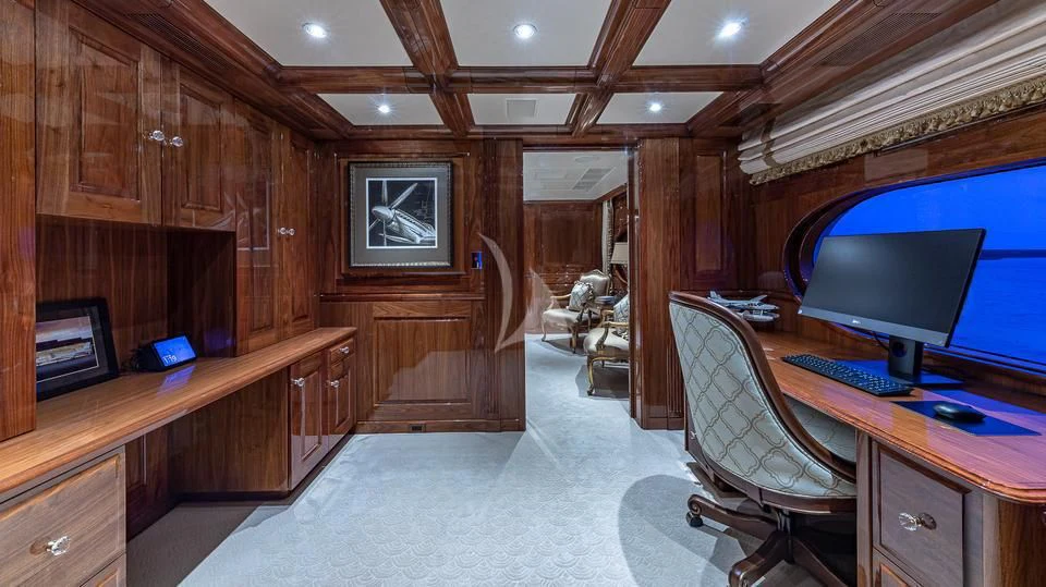 a room with a computer and a desk aboard SILVER LINING Yacht for Sale