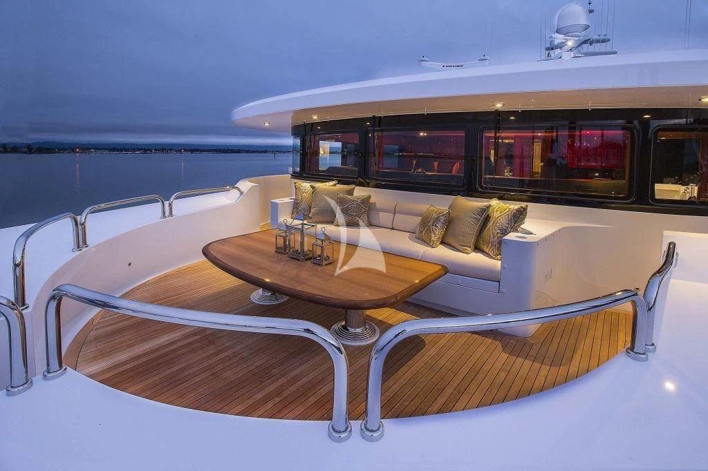 a table and chairs in a room aboard SILVER LINING Yacht for Sale