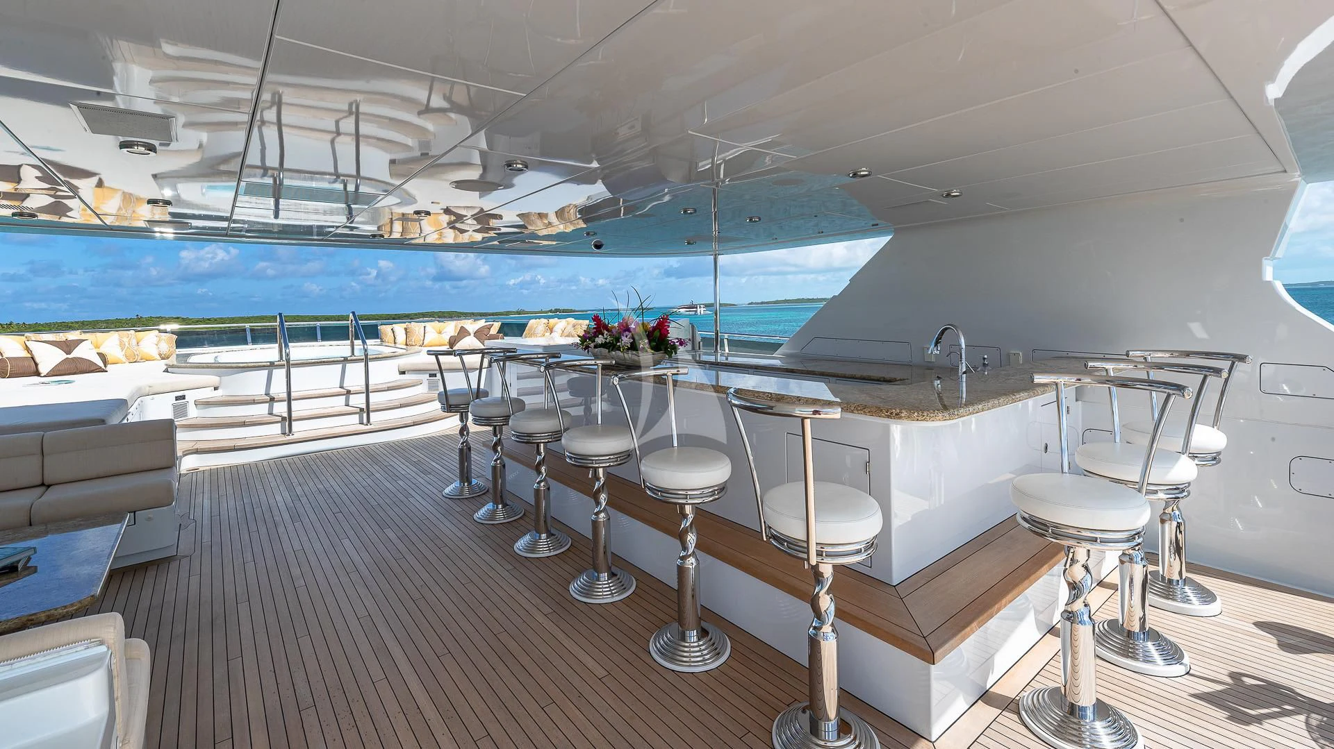 a room with tables and chairs aboard SILVER LINING Yacht for Sale