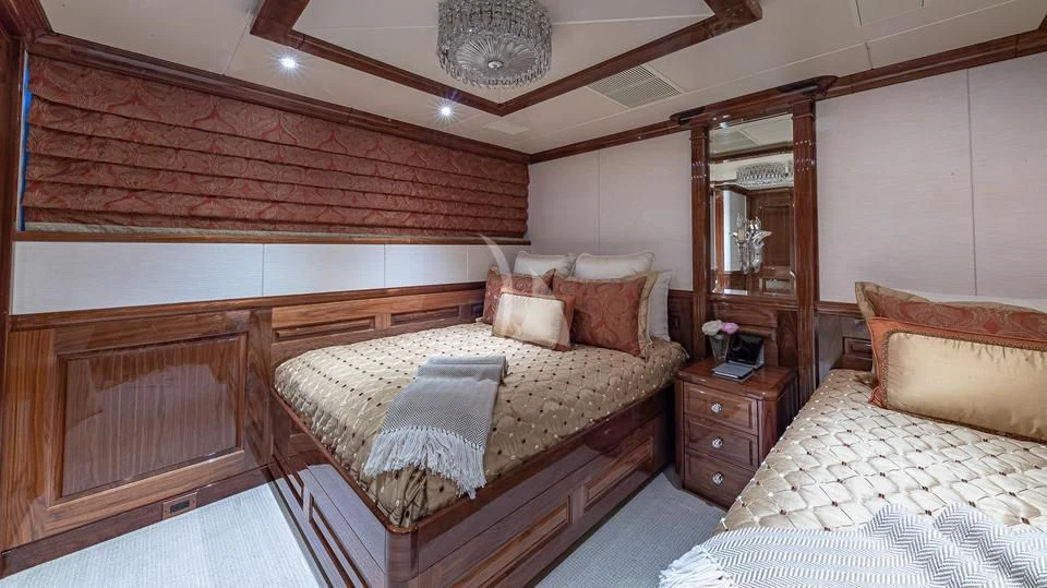 a room with a bed and a mirror aboard SILVER LINING Yacht for Sale