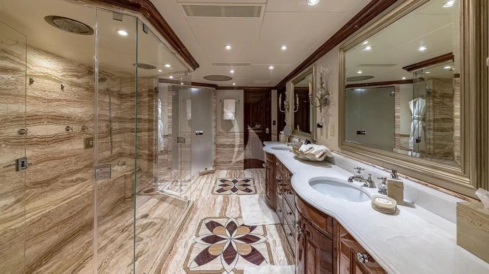 a bathroom with a large mirror aboard SILVER LINING Yacht for Sale