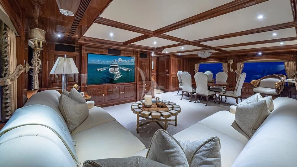 a living room with a large screen aboard SILVER LINING Yacht for Sale