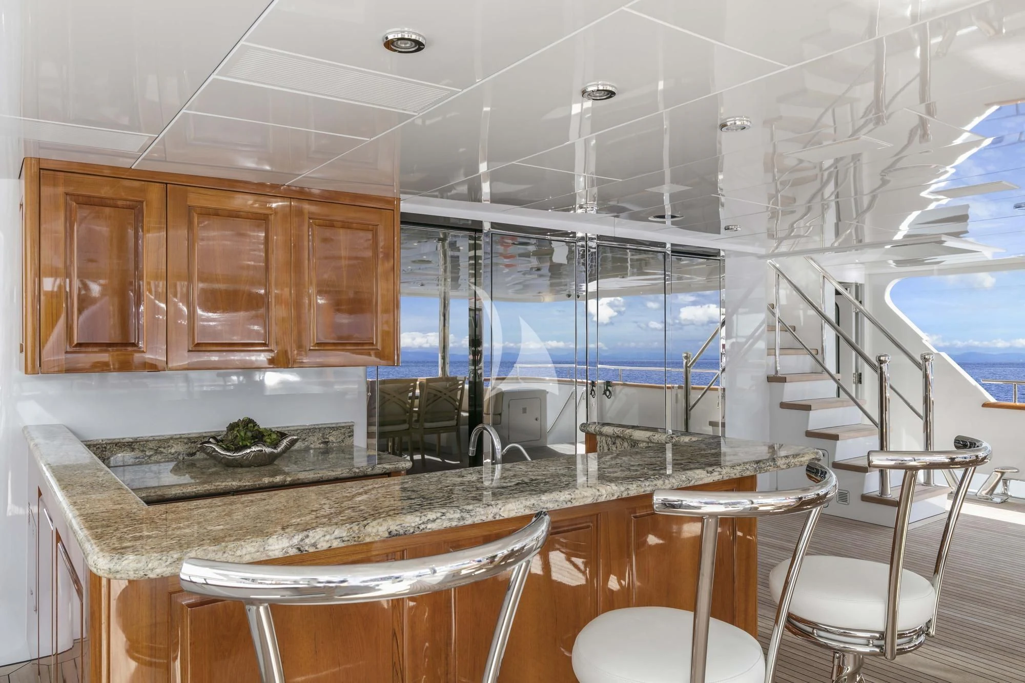 a kitchen with a large glass window aboard SILVER LINING Yacht for Sale