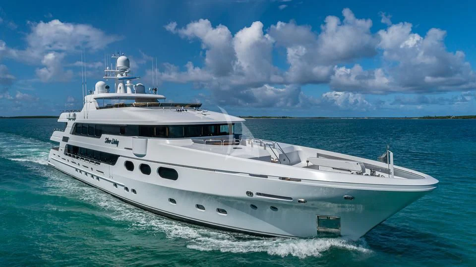 a white boat on the water aboard SILVER LINING Yacht for Sale
