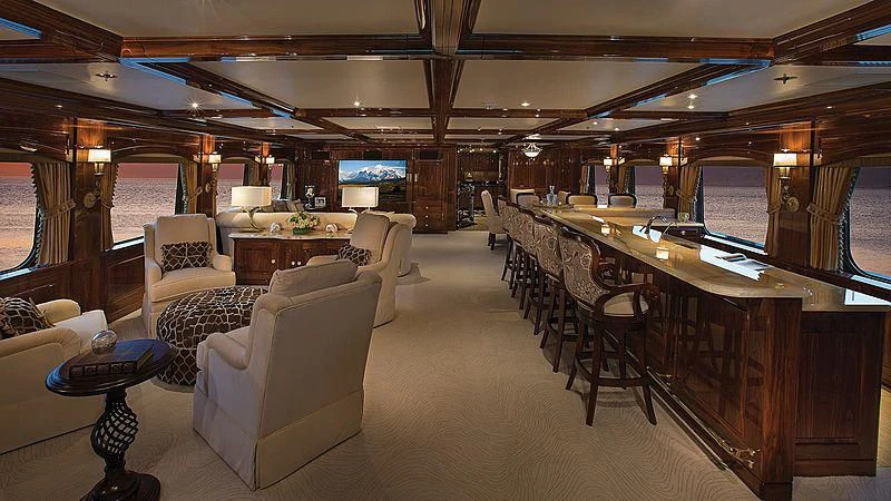 a large room with chairs and tables aboard SILVER LINING Yacht for Sale