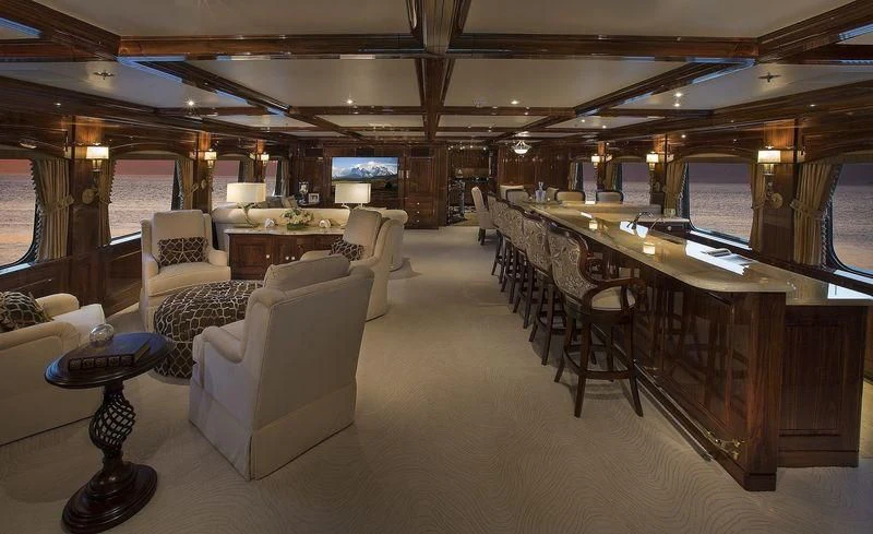 a large room with a table and chairs aboard SILVER LINING Yacht for Sale