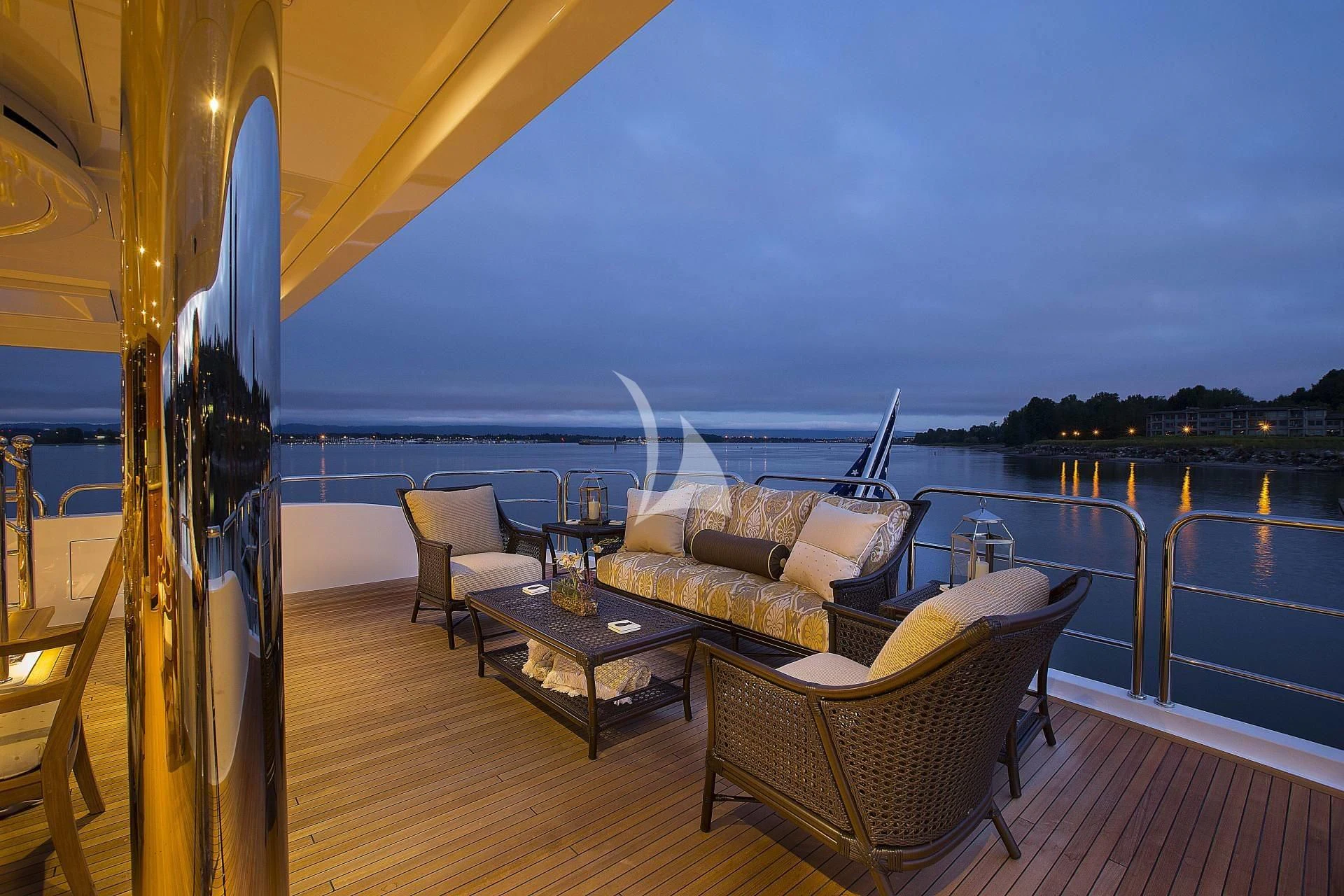 a deck with a view of the ocean and the ocean aboard SILVER LINING Yacht for Sale