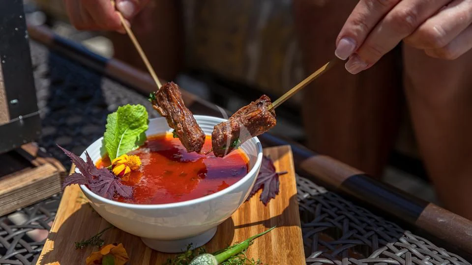 a person cooking food aboard SILVER LINING Yacht for Sale