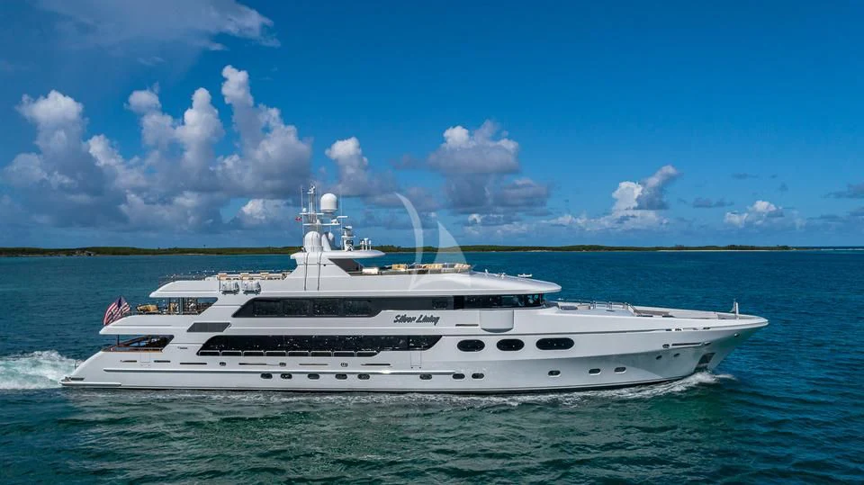 a white yacht in the water aboard SILVER LINING Yacht for Sale