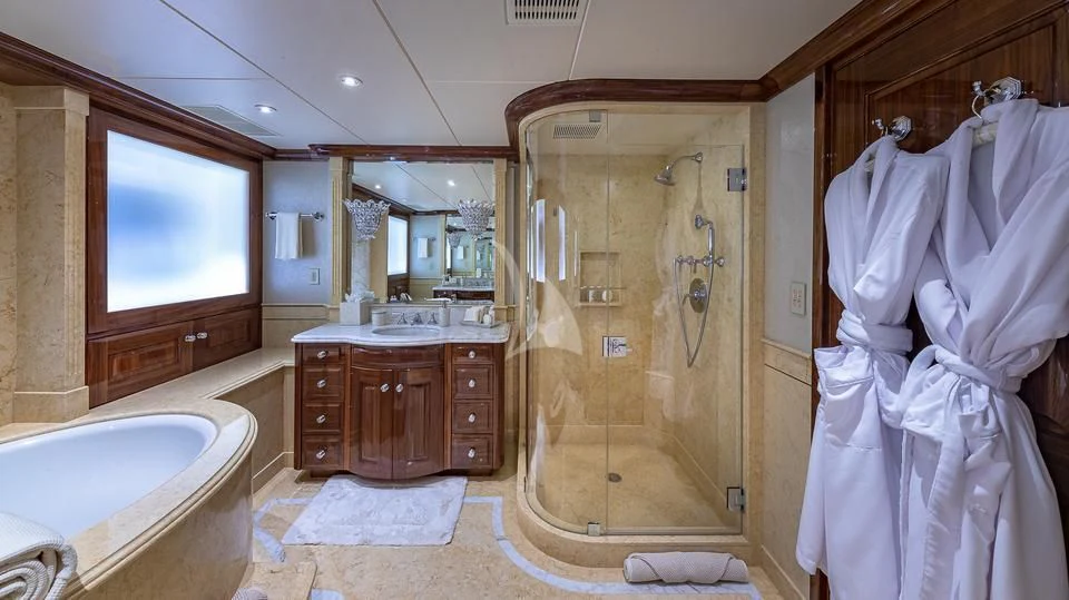 a bathroom with a shower and sink aboard SILVER LINING Yacht for Sale