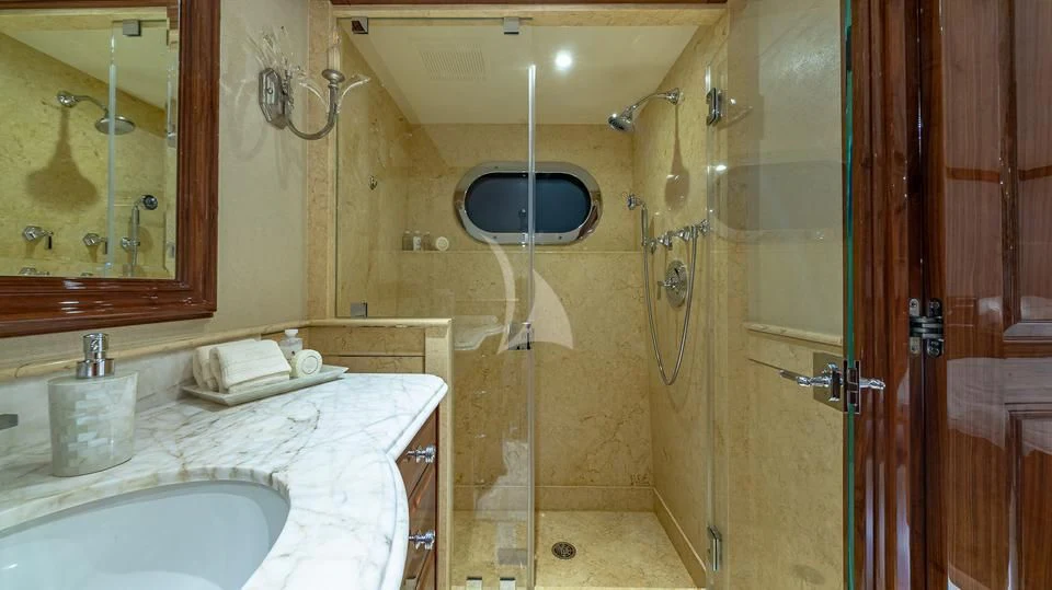 a bathroom with a sink and a mirror aboard SILVER LINING Yacht for Sale