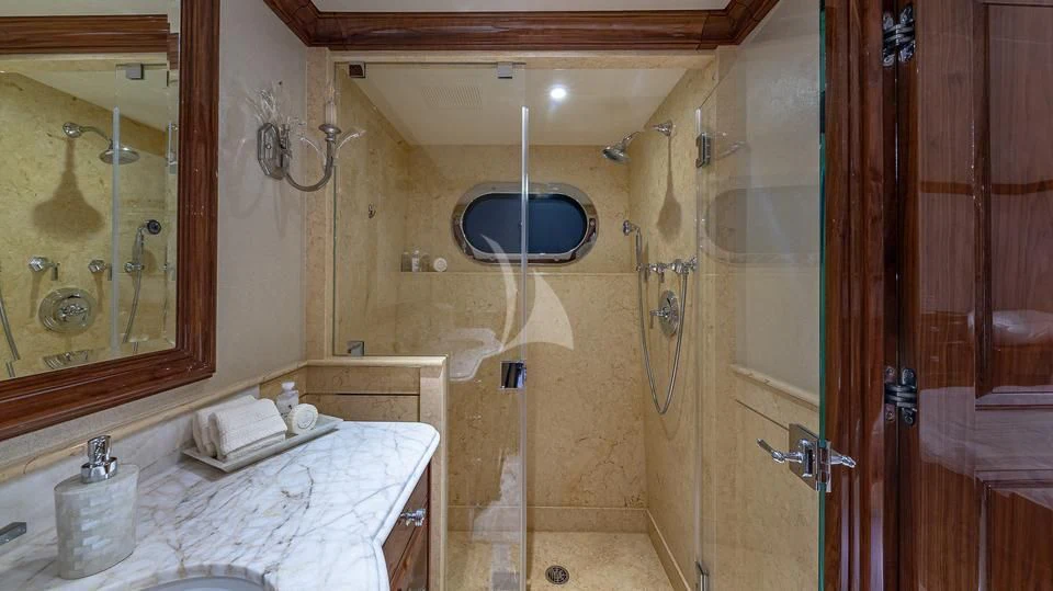 a bathroom with a large mirror aboard SILVER LINING Yacht for Sale