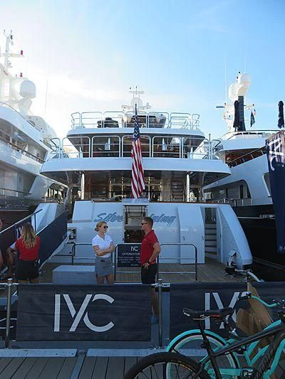 a group of people standing on a boat aboard SILVER LINING Yacht for Sale