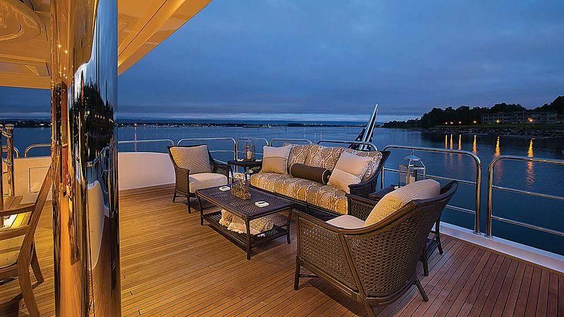 a deck with a view of the ocean and a beach aboard SILVER LINING Yacht for Sale