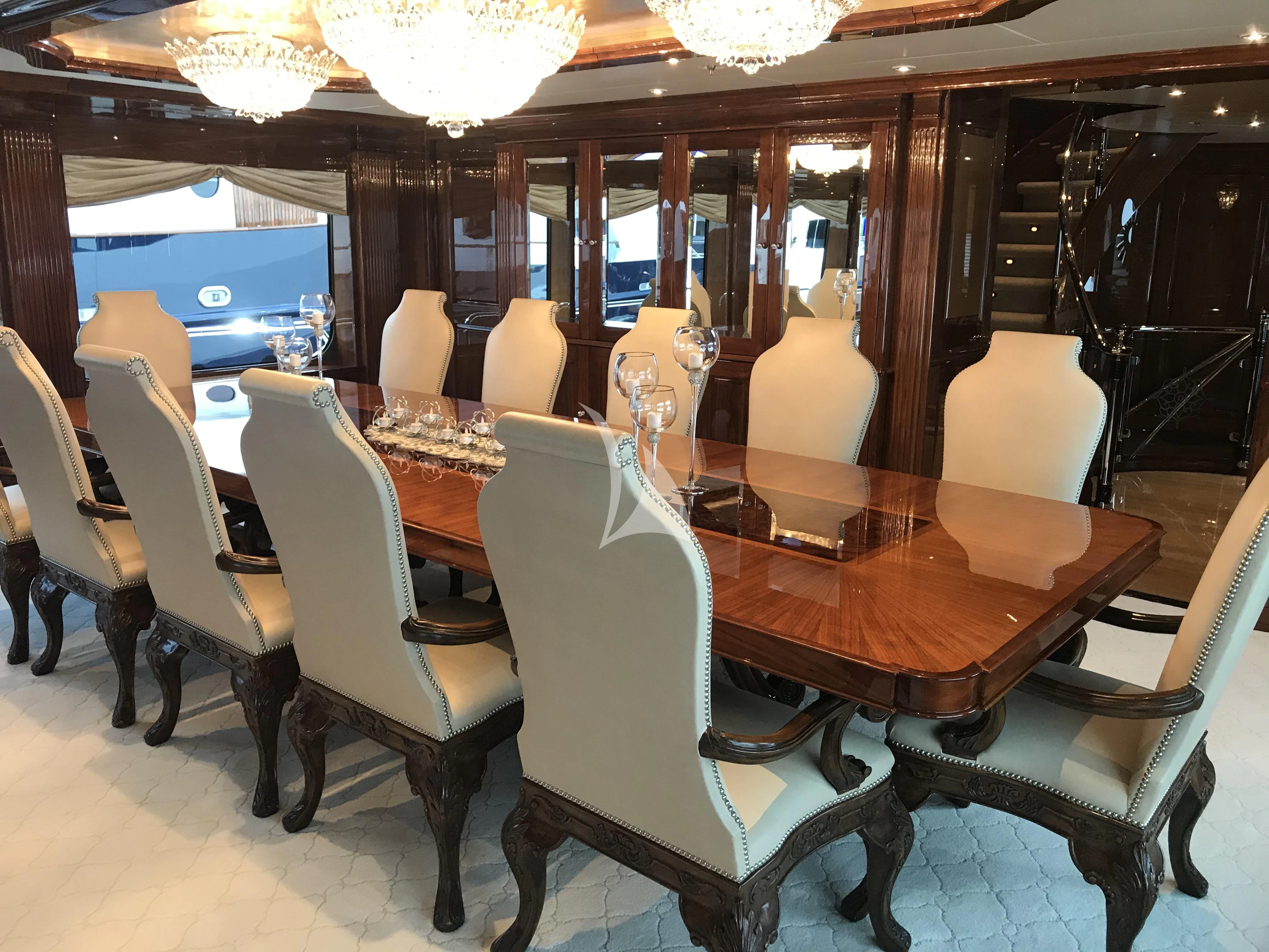 a room with a table and chairs aboard SILVER LINING Yacht for Sale