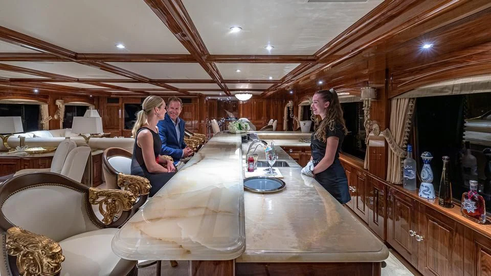 a group of people in a room aboard SILVER LINING Yacht for Sale