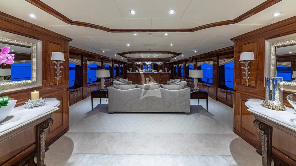a living room with a large mirror aboard SILVER LINING Yacht for Sale