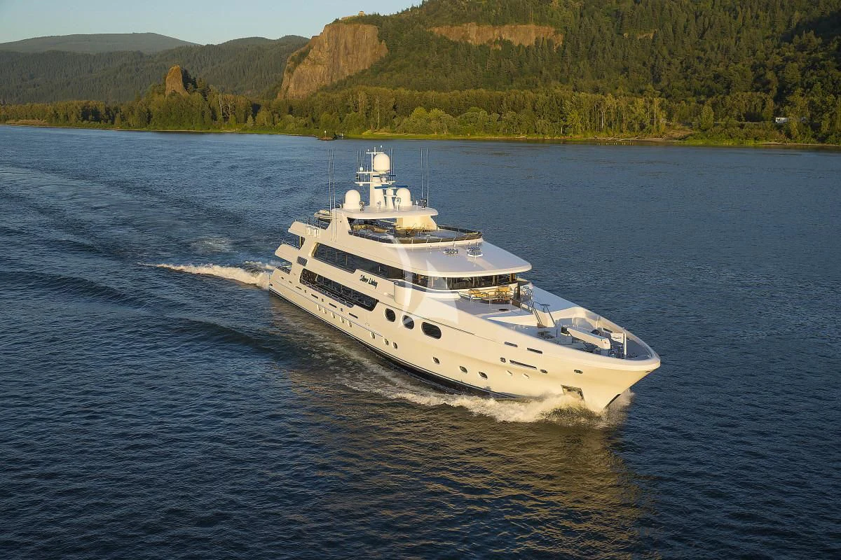 a white boat on water aboard SILVER LINING Yacht for Sale