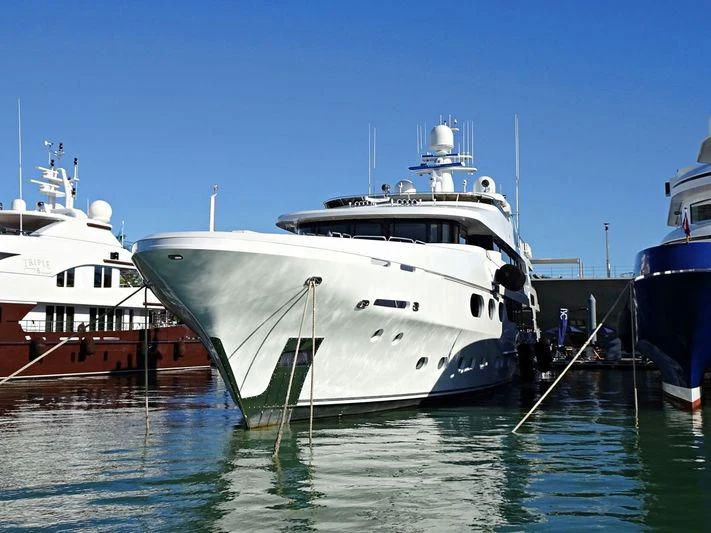 a group of boats are parked in the water aboard SILVER LINING Yacht for Sale