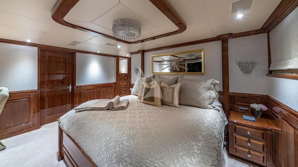 a bedroom with a large bed aboard SILVER LINING Yacht for Sale
