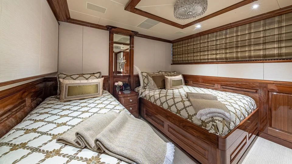 a room with a couple of beds aboard SILVER LINING Yacht for Sale