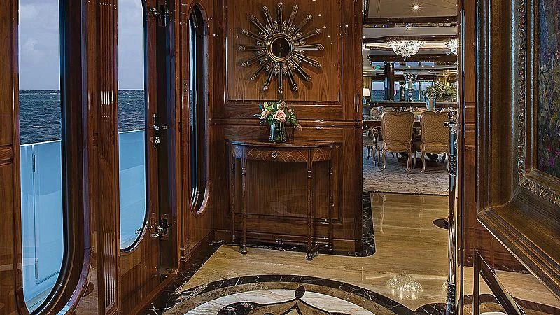 a room with a mirror and a table and chairs aboard SILVER LINING Yacht for Sale