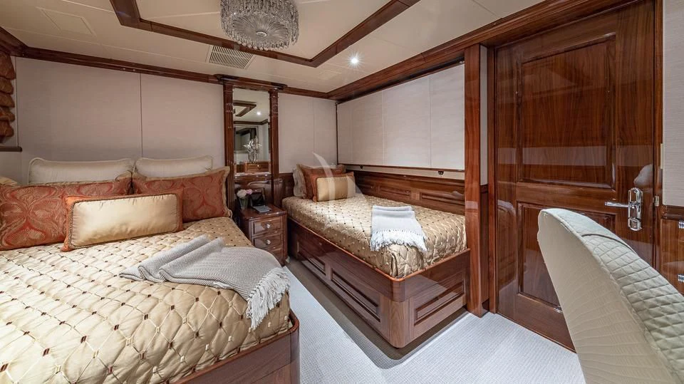 a room with a bed and a mirror aboard SILVER LINING Yacht for Sale