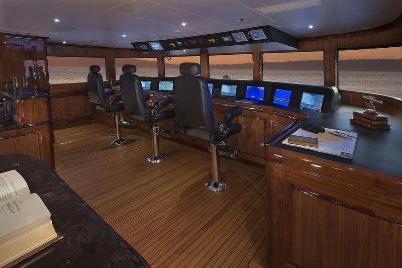 a room with computers and chairs aboard SILVER LINING Yacht for Sale