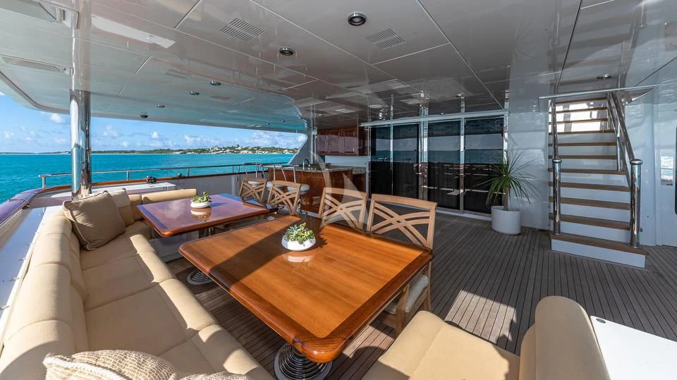 a living room with a large balcony aboard SILVER LINING Yacht for Sale