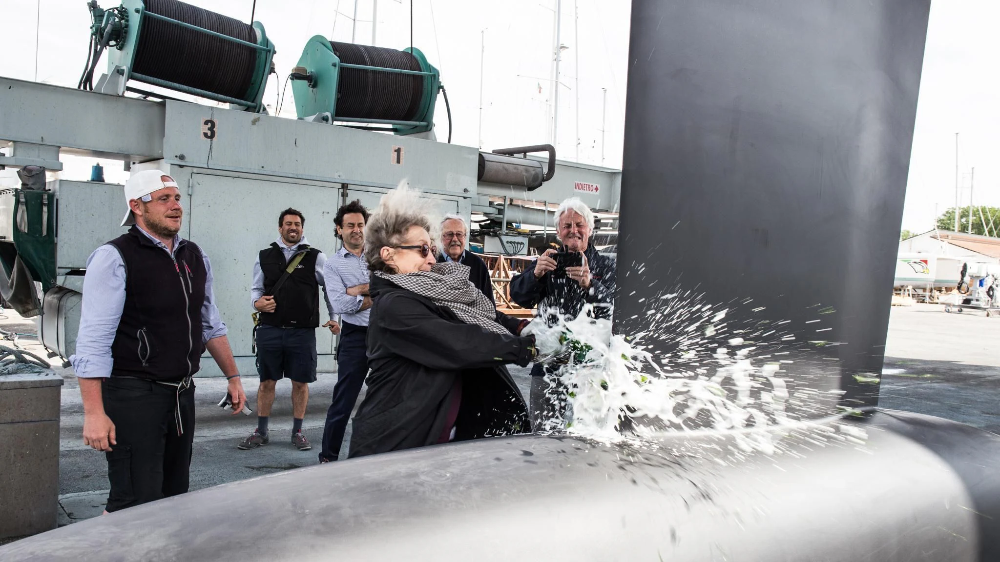 a group of people standing next to a tank with water coming out of it aboard BARONG D Yacht for Sale