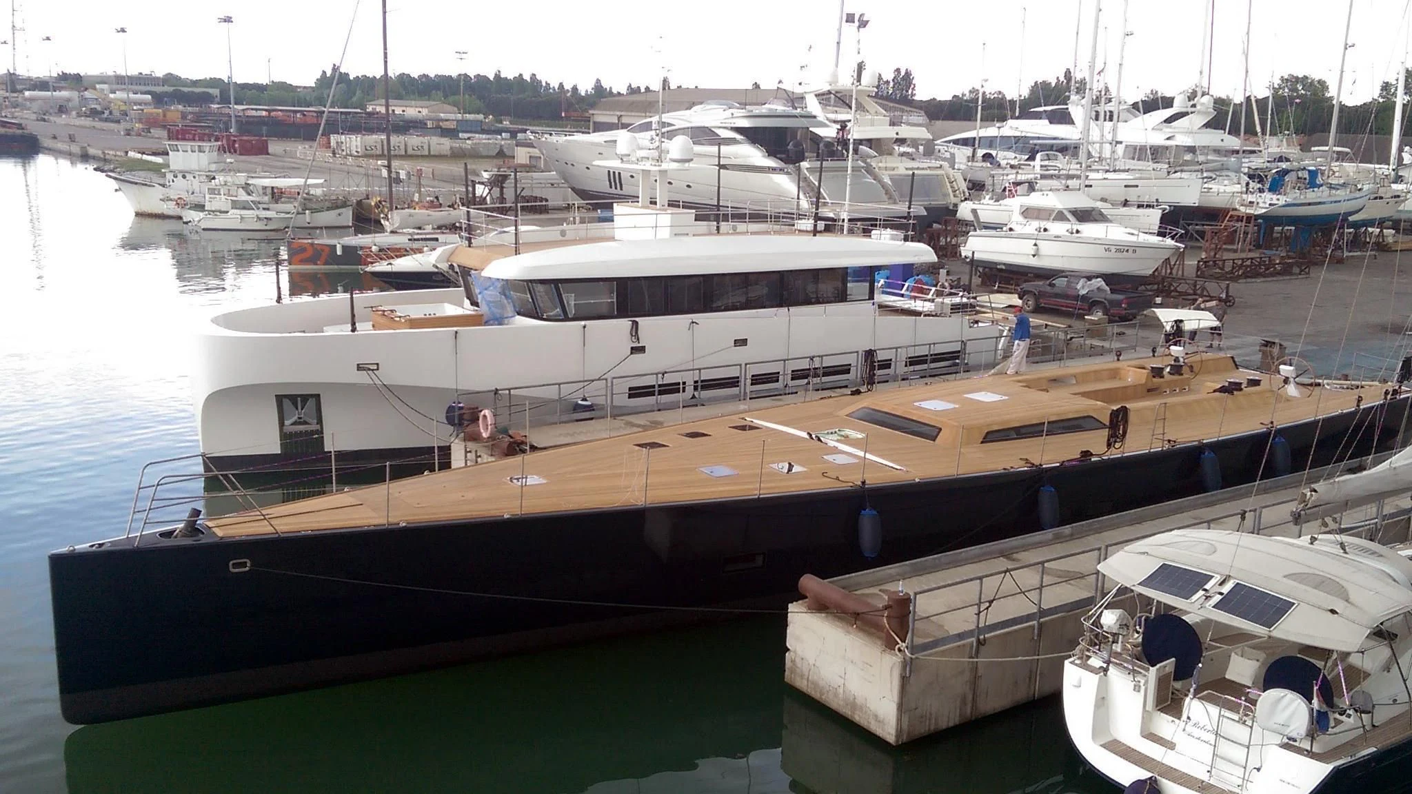 a boat docked at a pier aboard BARONG D Yacht for Sale