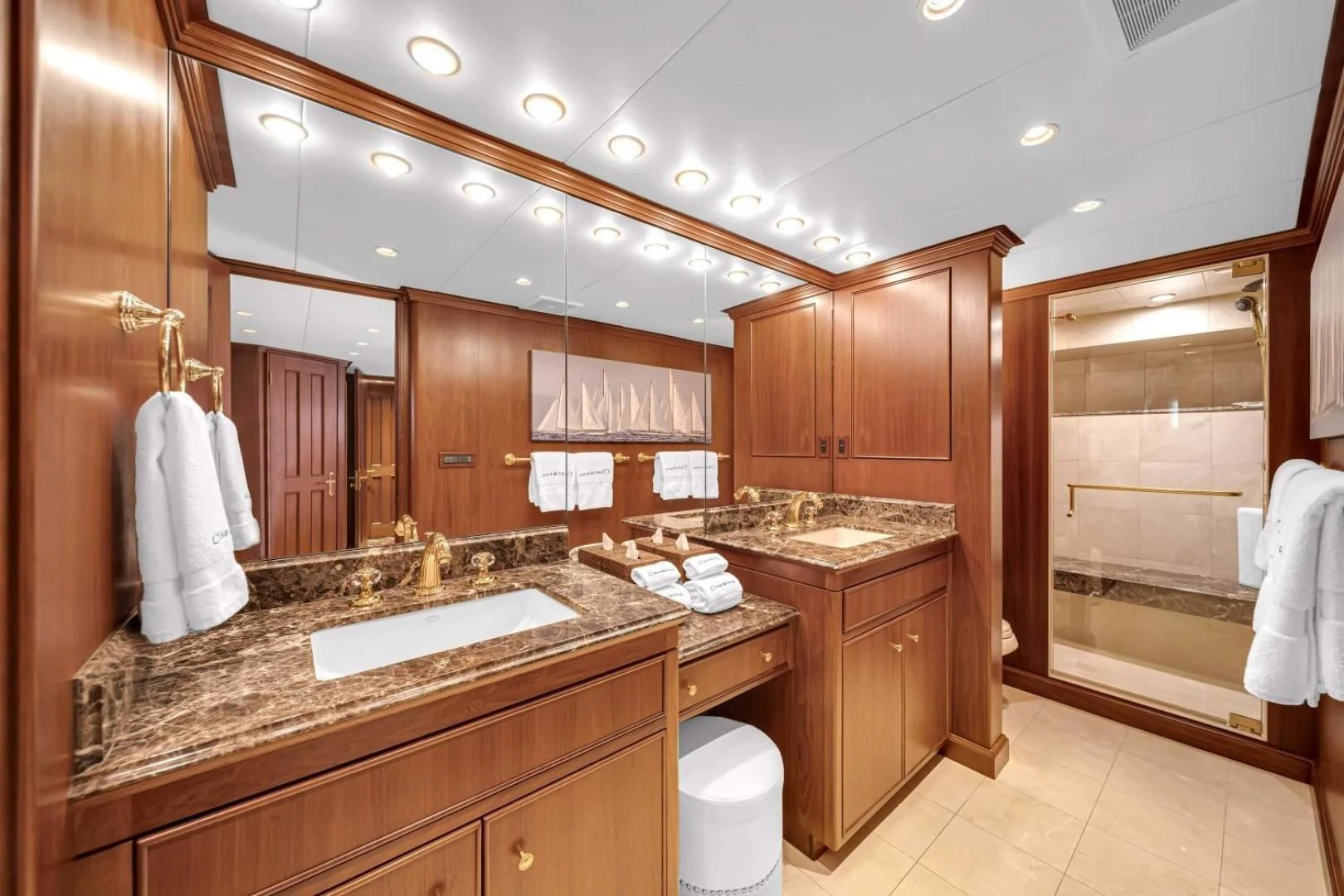 a bathroom with wooden cabinets aboard CHECKERS Yacht for Sale