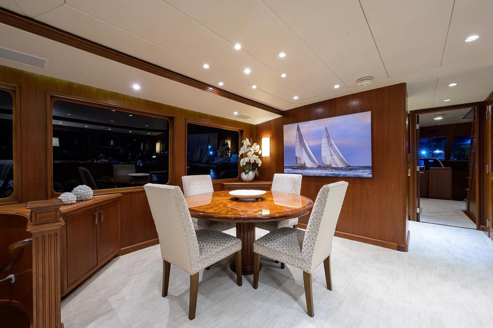 a room with a table and chairs aboard CHECKERS Yacht for Sale