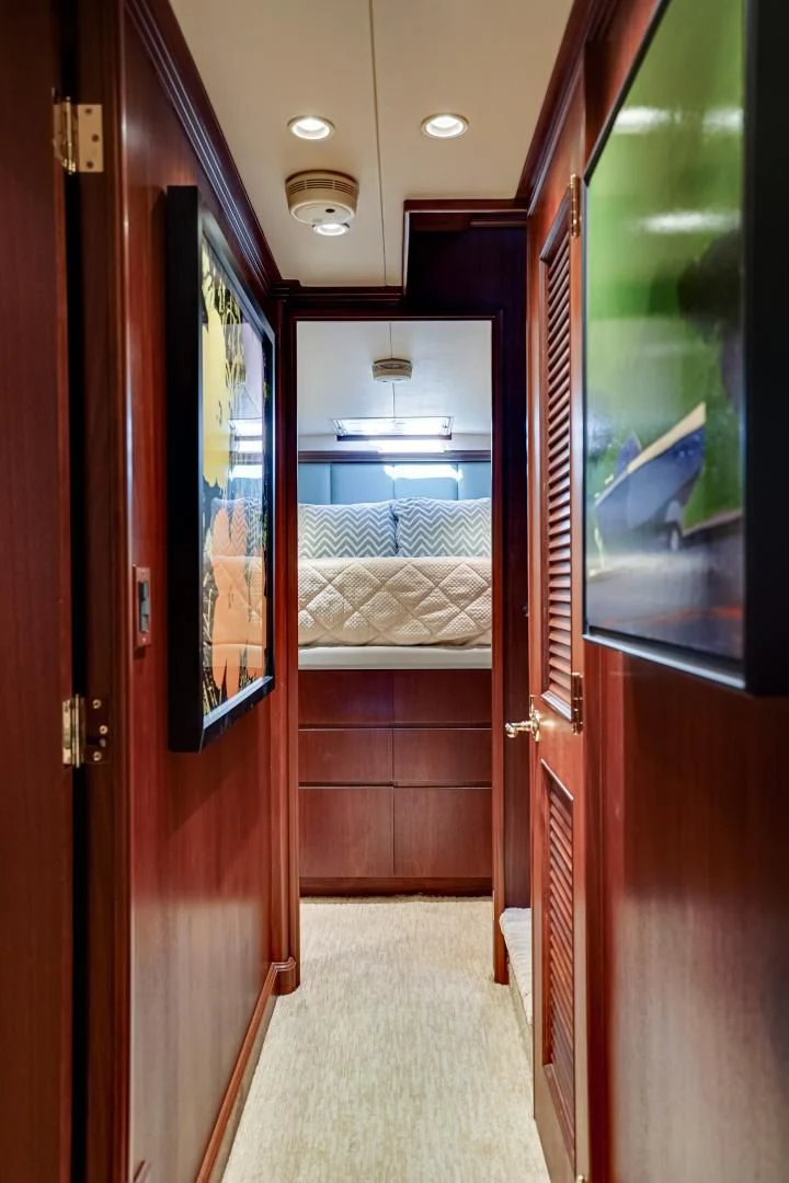 a room with a bed and a door aboard CHECKERS Yacht for Sale