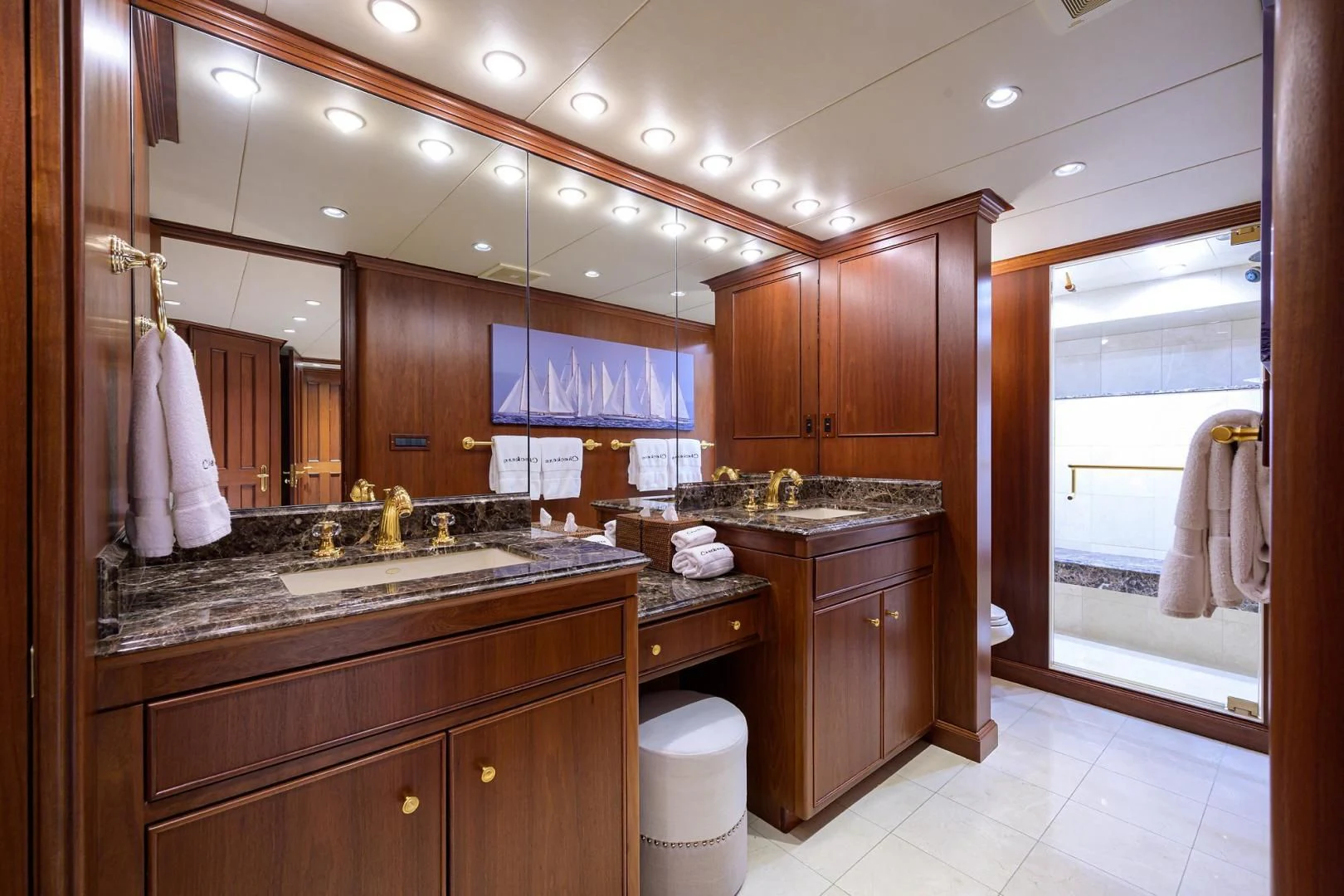 a bathroom with wooden cabinets aboard CHECKERS Yacht for Sale