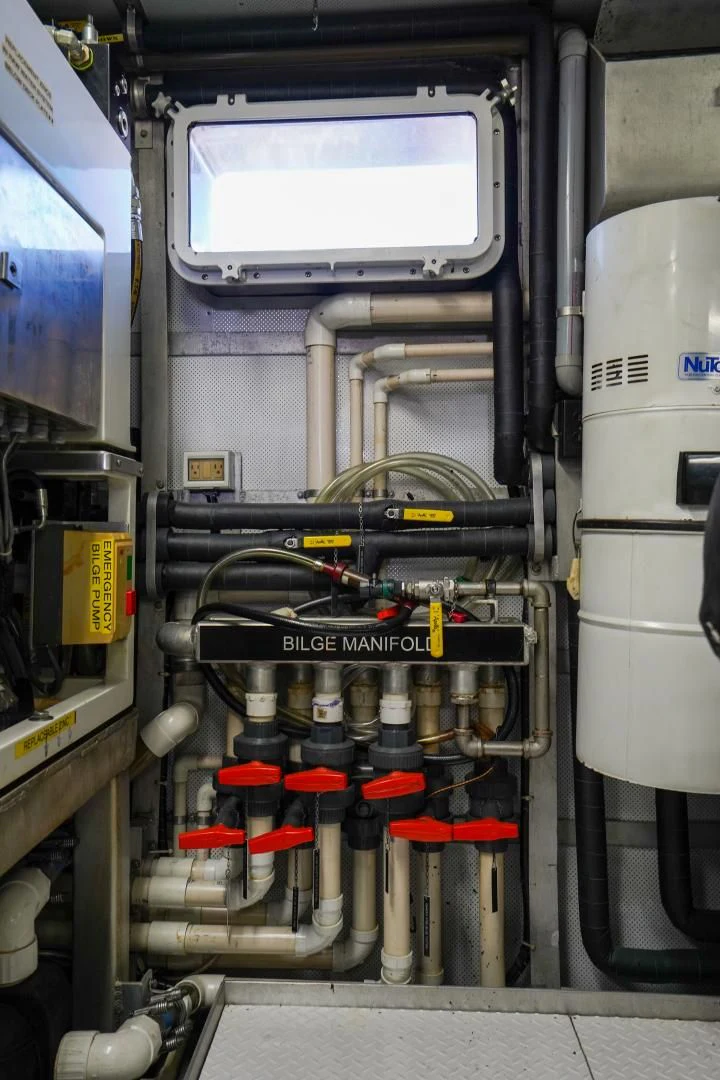 a machine with a large piece of equipment in it aboard CHECKERS Yacht for Sale