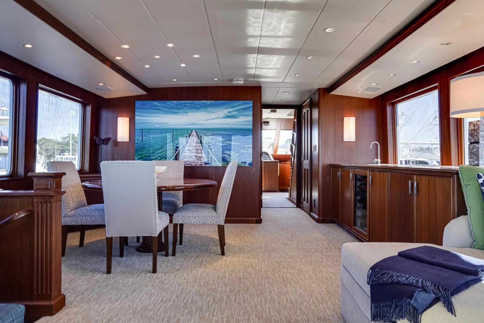a room with a table and chairs aboard CHECKERS Yacht for Sale