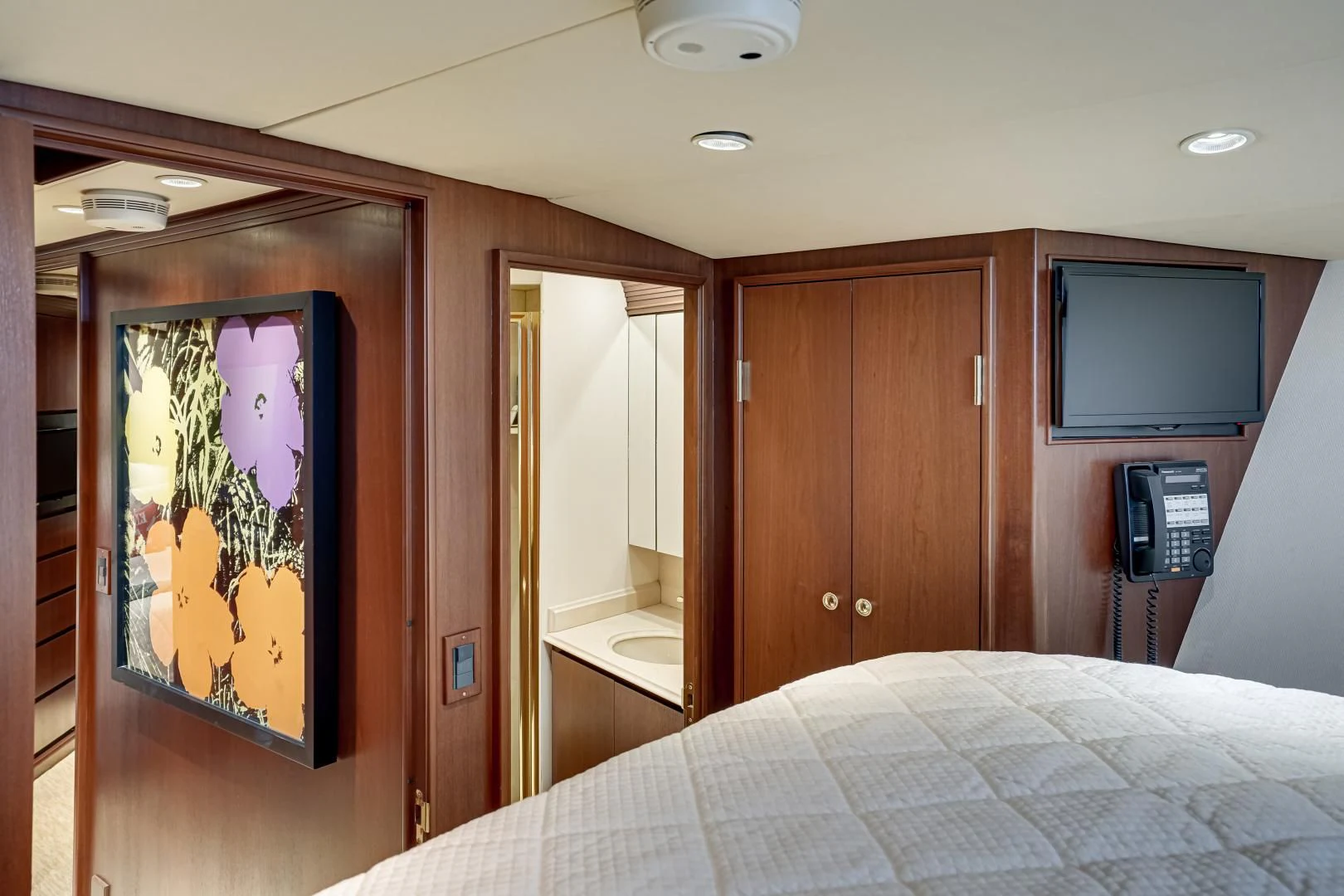 a bed in a room aboard CHECKERS Yacht for Sale