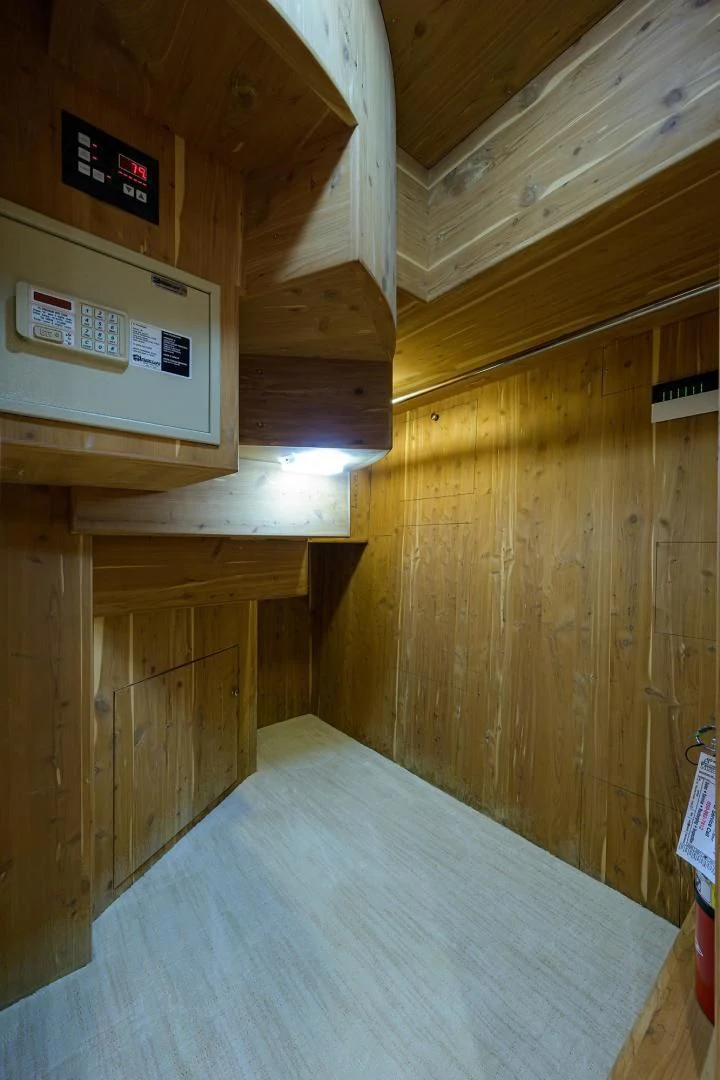 a wooden room with a table and a sign on the wall aboard CHECKERS Yacht for Sale