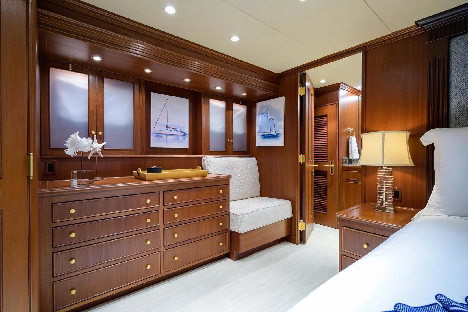 a bedroom with a bed and a desk aboard CHECKERS Yacht for Sale