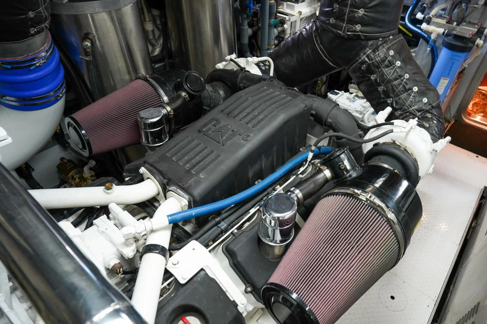 a person working on a car engine aboard CHECKERS Yacht for Sale