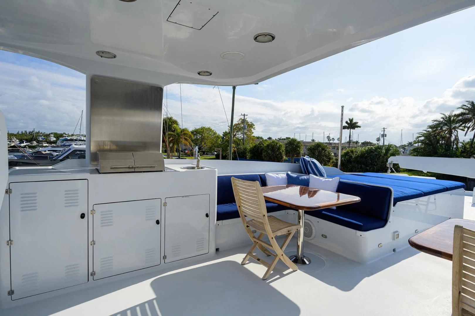 a room with a pool and a table and chairs aboard CHECKERS Yacht for Sale