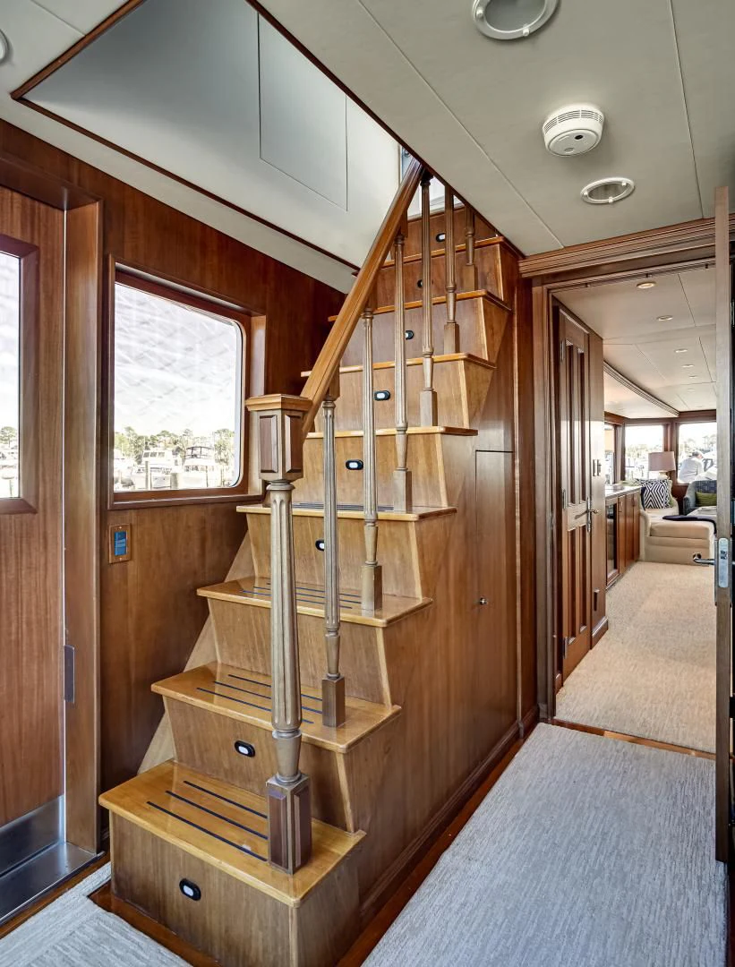 a wooden bunk bed in a room aboard CHECKERS Yacht for Sale