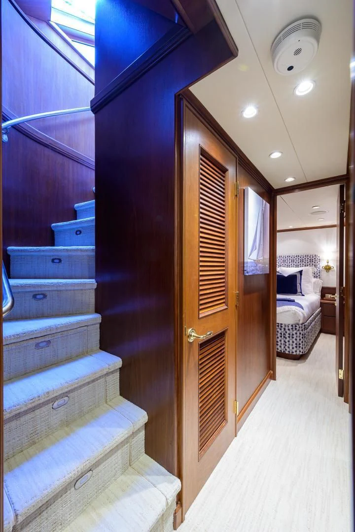 a room with a bed and a closet aboard CHECKERS Yacht for Sale