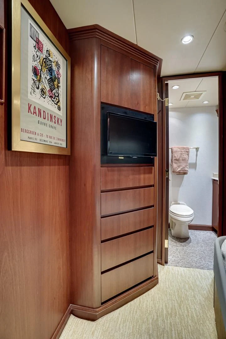 a wood cabinet in a bathroom aboard CHECKERS Yacht for Sale