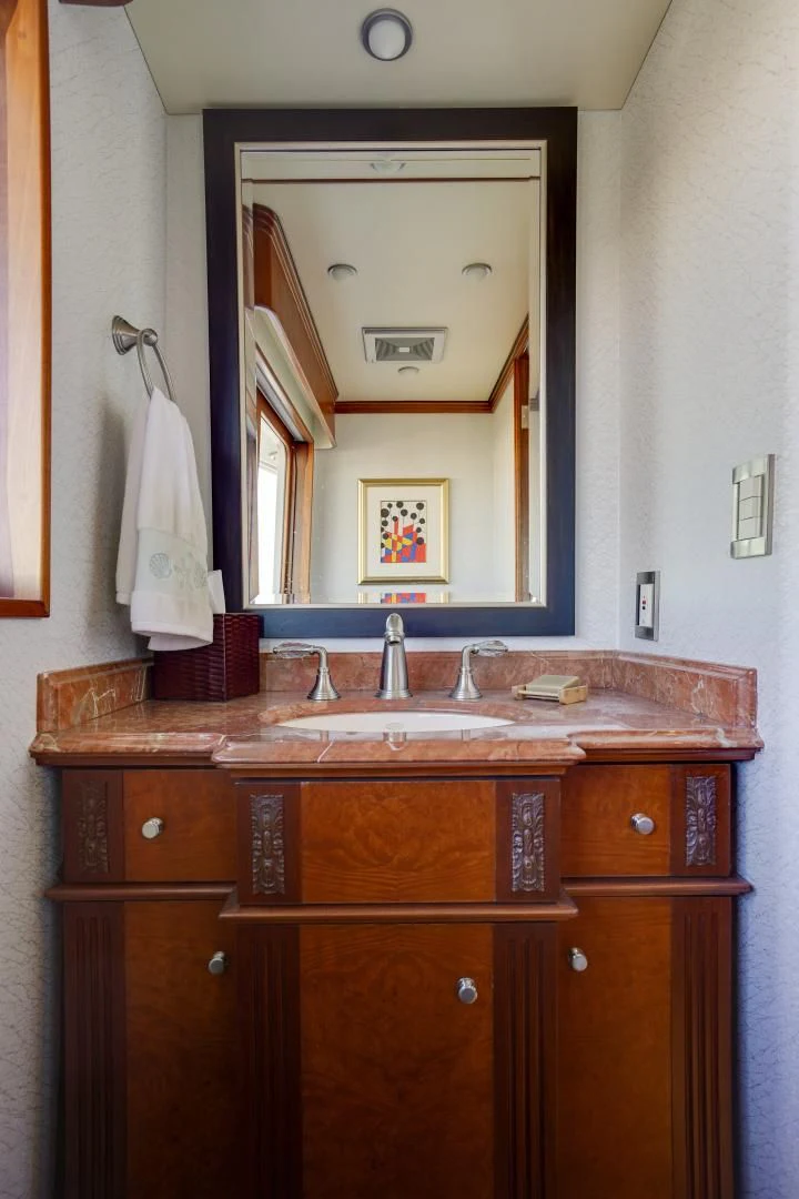 a bathroom with a mirror aboard CHECKERS Yacht for Sale