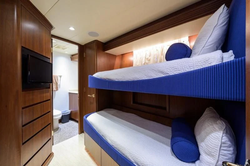 a bed in a room aboard CHECKERS Yacht for Sale