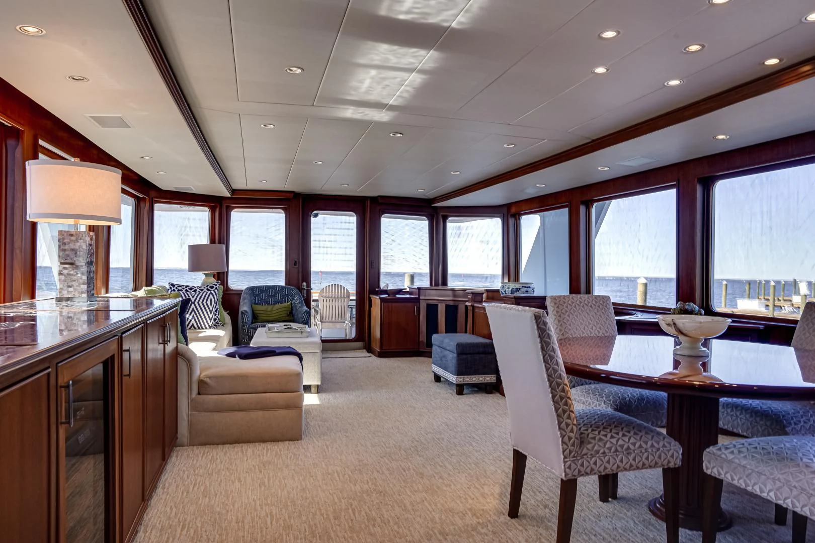 a large room with a table and chairs aboard CHECKERS Yacht for Sale