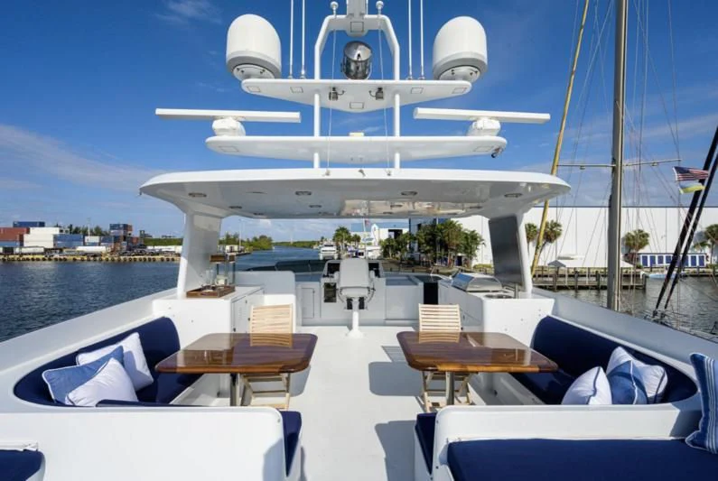 a plane flying over a boat aboard CHECKERS Yacht for Sale