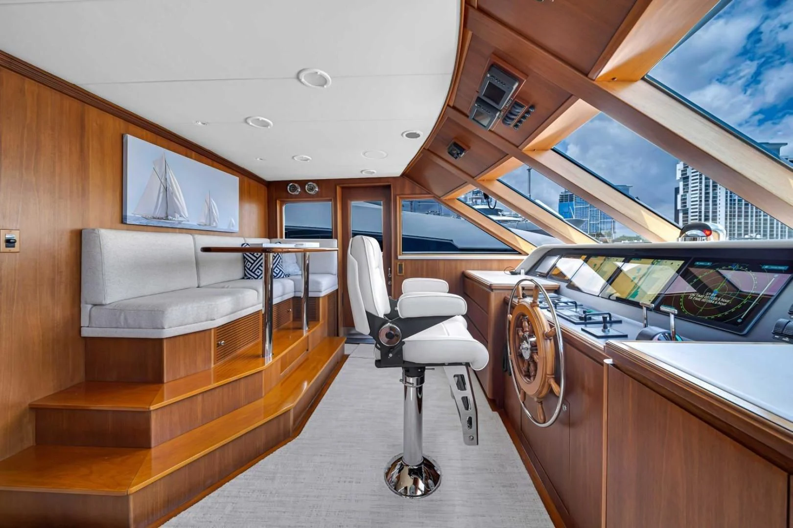 a room with a chair and a table and a bench aboard CHECKERS Yacht for Sale